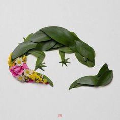 a lizard made out of flowers and leaves