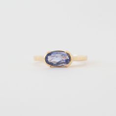 A modern and unexpected departure from the typical engagement ring, the Avery Ring features a stunning East West set blue sapphire. The half-bezel setting makes the stone to really pop, showing off its stunning purple-blue hue. Details 1.58ct Ceylon Blue Sapphire: 9.70x5.40mm 14K yellow gold weighing 4.26 grams Current size: 8 with complementary resize Band width: 2.15mm Half bezel set center stone Low set: looks great with Cleo, Jamie (second photo), and Thea Bands One of a kind center stone Sh Blue Enamel Ring, Bezel Sapphire Ring, East West Sapphire Ring, Blue Moissanite Engagement Ring, Bezel Sapphire Engagement Ring, Unique Gemstone Rings, East West Half Bezel, Sapphire Bezel Ring, Half Bezel Engagement Ring