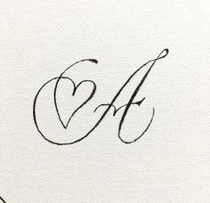 the letter e is inscribed in cursive writing with a black ink pen on white paper