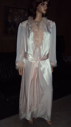 This is a very RARE Vintage 90's JONQUIL By DIANE SAMANDI Light Pink Wet Looking Satin, Laced, Beading, Pleated Nylon chiffon With Maribo Feathers Long / Tall Nightgown & Robe Set that is tagged a size Large in both pieces of the set but by their style & measurements will fit both some size Medium's & some size Large's thus my listing. SEE MEASUREMENTS FOR PROPER FITTING. The sets pieces are in very good vintage condition ! The NIGHTGOWN comes with a netted , laced , beading & sequends  cowl neck & front ( see pics ) , a low sensual back ( see pics ) that also has a laced lower pleated chiffon nylon insert ( see more pics )  , non adjustable shoulder straps & a tapered full hem. BUST  34 - 38 more fully stretched with at the size 38 bust measurement A or B Bust cup sizing, WAIST  to 38, HI Silk Fitted Robe For Wedding Night, Full-length Gown For Wedding Night, Vintage Satin Sleepwear For Wedding, Vintage Satin Wedding Sleepwear, Fitted Silk Wedding Robe, Pink Silk Sleepwear For Evening, Long Sleeve Silk Wedding Sleepwear, Sheer Long Sleeve Wedding Nightgown, Elegant Pink Nightgown For Evening