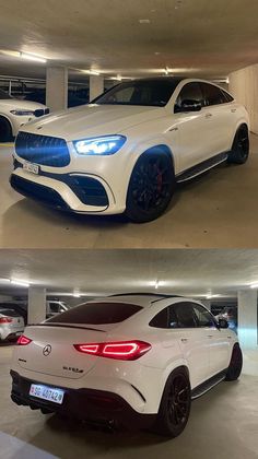 two different cars parked in a parking garage next to each other, one is white and the other is blue