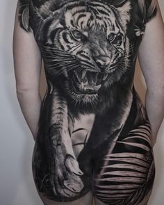 the back of a woman's body with an image of a tiger on it