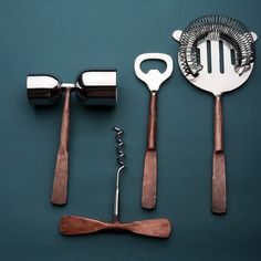 kitchen utensils are arranged on a blue surface