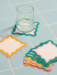 The Teatime Scalloped Coaster Set is so cute! With a wavy edge and on-trend colors, you'll set your table in style with these hand-printed coasters. Made with thick, absorbent blotter paper intended to withstand everyday use. Should any warping occur, simply dampen the coaster and flatten it under a heavy object. Set of 8 Letterpress Printed Coasters in an Acrylic Keepsake Box Each Set Contains 2 Designs Painted Coasters Square, Ceramic Coaster Ideas, Wavy Decor, Clay Coasters Diy, Diy Clay Coasters, Painted Tile Coasters, Funky Coasters, Coaster Design Ideas, Coasters Painting