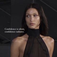 a woman wearing a black halter top with the words, confidence is silent, confidentness radiates