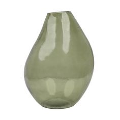 a green vase sitting on top of a white surface