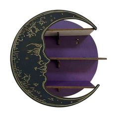 a purple shelf with shelves on it and a crescent shaped clock hanging from the wall