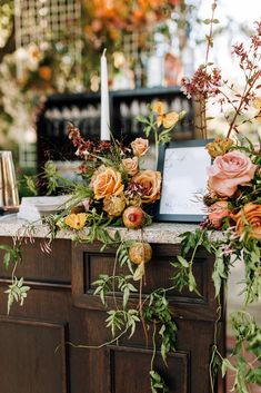 a table with flowers and candles on it