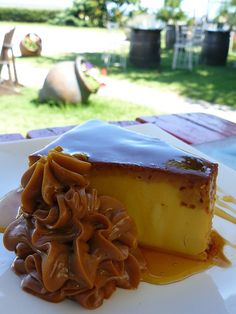 a piece of cake on a plate with caramel sauce