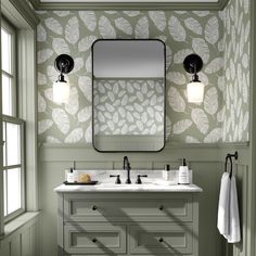 a bathroom with two sinks and a large mirror