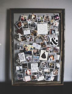 a wooden frame with many pictures on it