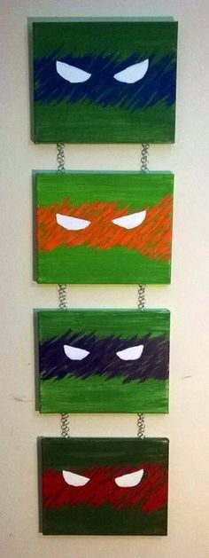 three pieces of art that have been painted to look like teenage mutant ninja masks on them