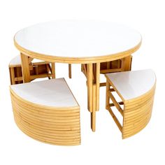 a round table with four chairs and one bench on the bottom is made out of bamboo