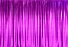 a purple curtain with long fringes on it