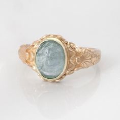 This vintage style sea-themed signet ring, featuring beautiful little shells and ocean-inspired fluorishes all around the center which displays a lovely seafoam green tourmaline cabochon. You may also select from other available gemstones shown such as citrine, pink tourmaline, peridot and aquamarine.  (NOTE: Please SELECT and state in the order notes the stone you prefer in the listing! Please also note that gemstones can vary slightly in color and texture. Upon request, we can send a photo of Lily Ring, Ocean Ring, Green Stone Ring, Ring Inspo, Unique Rings Vintage, Green Stone Rings, Photo Packages, Monogram Ring, Yellow Gemstones