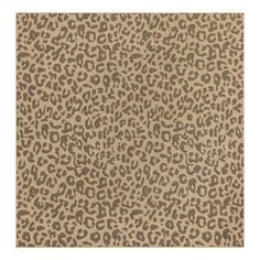 an animal print rug in beige and brown