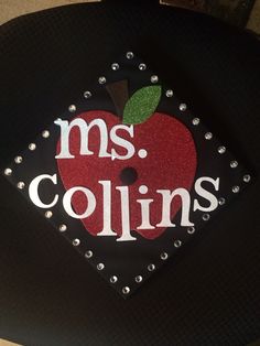 a black hat with an apple and the words ms collins on it