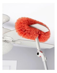 a red dust mop is attached to the ceiling