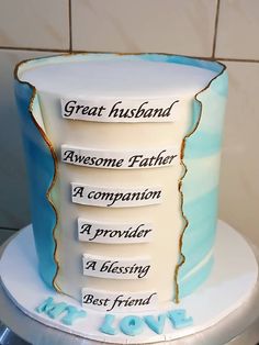 a three tiered cake with writing on it