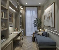 a living room with a couch, desk and bookshelf next to a window