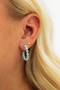 Elevate your style with these stunning Floral Hoop Earrings in light blue! These hoop earrings feature delicate floral details that add a touch of elegance to any outfit. The perfect accessory to enhance your natural beauty and make a statement! Sparkle and shine with these must-have earrings. Floral Hoop Earrings-Light Blue, boutique clothing, casual, the perfect earrings! Boutique Clothing Trendy Outfits, Blue Boutique, Floral Azul, Floral Hoops, Clothing Casual, Sparkle And Shine, Bring Happiness, Belleza Natural, Boutique Clothing