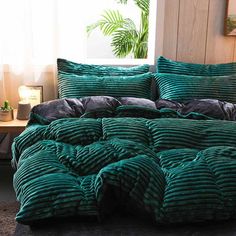 the comforter is green and black in color