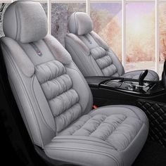 the interior of a car with grey leather seats