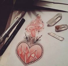 a drawing of a heart with diamonds on it and some other items around the image