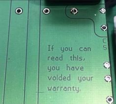 an electronic circuit board with the words if you can read this, you have volled your warrant