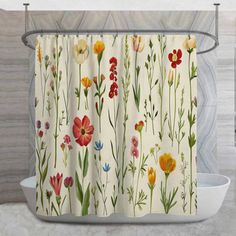 the shower curtain is decorated with colorful flowers