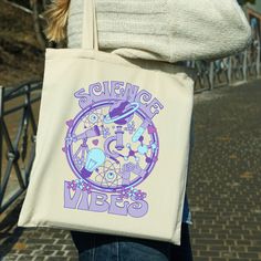 "This cute science themed tote bag will be the perfect gift for the scientist, science teacher, chemistry or biology teacher in your life. This design is available on other products, so check out my store! This 100% cotton bag comes in one size - 15\" x 16\"- perfect for everyday wear. The tote bag is durable and will last for years, it features 20\" handles (made from the same canvas), making it easy to carry even with a week's worth of shopping. .: 100% cotton canvas .: Heavy fabric (12 oz/yd² (406.9 g/m .: Sewn-in label The tote bag is printed on one side." Back To School Funny, Tote Bag Business, Material Science, Science Teacher Gifts, Biology Teacher, Science Illustration, Teacher Tote, Science Themes, Science Gifts