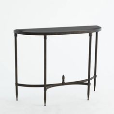 a black console table sitting on top of a white floor