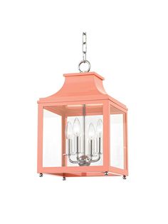 a pink light fixture with three lights hanging from it's side and one light on the