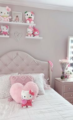 a hello kitty bedroom with pink and white decor