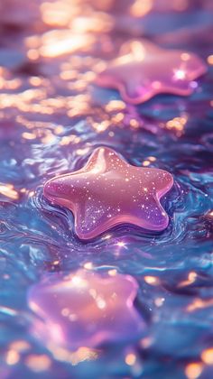 a star shaped object floating on top of blue water with bubbles and stars in the background