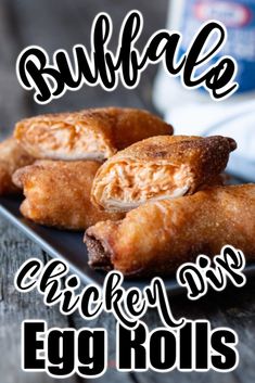 some fried food on a black plate with the words buffalo chicken rolls written in white