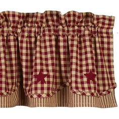 red and white checkered curtains with star appliqued on the bottom curtain