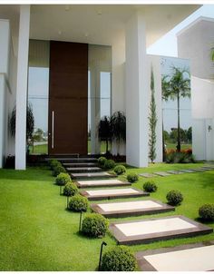 this is an image of a modern house with steps leading up to the front door