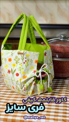 a green bag sitting on top of a table