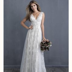 a woman in a wedding dress holding a bouquet