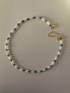 🌟 OUR DELICATE SIREN FRESHWATER PEARL NECKLACE WITH UNIQUE APATITE 🌟 HANDMADE WITH LOVE The small, delicate freshwater pearls are the focus of this elegant necklace, giving it an aura of timeless elegance and grace. The faceted apatite beads set a unique accent and represent self-confidence, communication and inspiration. The gold beads and clasp are plated with 18k gold to ensure durability and elegance. WHY OUR SIREN FRESHWATER PEARL NECKLACE WITH APATITE? ✨ Unique design of the highest qual Cheap Beaded Pearl Necklace For Beach, Handmade Necklace Designs, Small Pearl Necklace, Handmade Pearl Necklace, Golden Beads, Pearl Necklace Designs, Beaded Necklace Designs, Freshwater Pearl Jewelry, Bead Necklaces