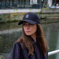 A stylish geometric embroidered black baseball cap, made from a wonderful melton wool blended fabric with a fuzzy texture.Embroidered with an elegant Celtic Knot Pattern that goes round in an infinite loop, an abstract mathematical knot.Fit & Finish-   Adjustable size strap with buckle-   6-panel construction-   Firm Peak-   Deep fit - sits fairly deep on the crown of the headBlck 6-panel Cap, Black Wool Cap, Embroidered Black Cap, Textured Black Hat, bucket hat, cool Dad Hat, Visor Cap, Pea Winter Baseball Cap With Embroidered Logo And Curved Brim, Winter Baseball Cap With Embroidered Logo, Black Winter Fitted Cap, Winter Urban Baseball Cap With Curved Brim, Urban Winter Baseball Cap With Curved Brim, Black Curved Brim Fitted Hat For Winter, Winter Snapback Baseball Cap With Embroidered Logo, Black Fitted Hat With Curved Brim For Winter, Winter Urban Curved Brim Baseball Cap