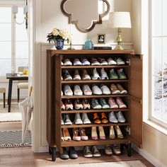 a wooden shoe rack filled with lots of shoes