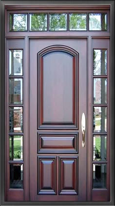 a close up of a wooden door with glass panes on the front and side