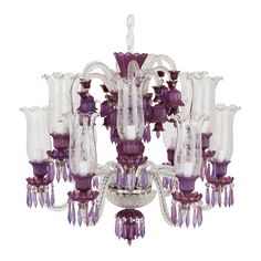 a chandelier with purple and white glass pieces hanging from it's center