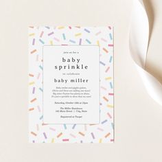 a baby sprinkle is on top of a card