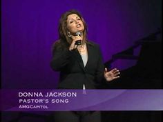 a woman singing into a microphone in front of a purple background with the words donna jackson pastor's song amgaptol