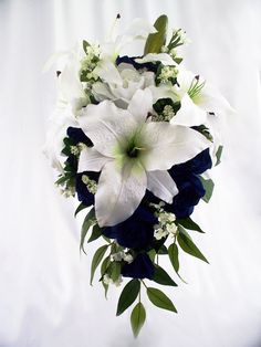 a bridal bouquet with white flowers and greenery on the bottom, against a white background