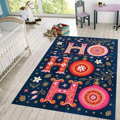 a child's room with a blue rug and white crib in the background