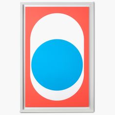 a blue and white circle on an orange background is framed in a light wood frame